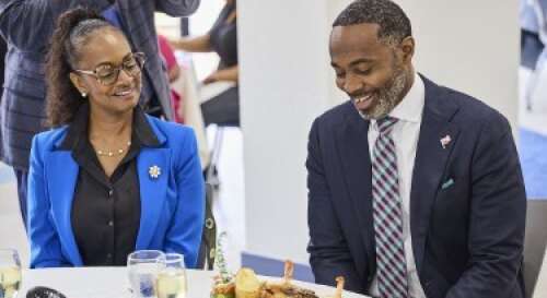 Students prepare and serve meals to politicians