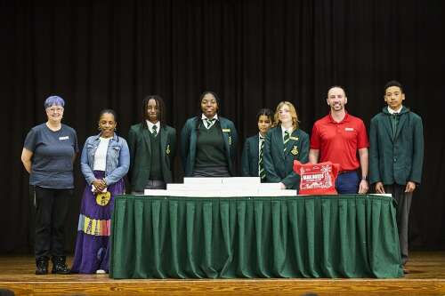 Courier company makes donation of laptops to school