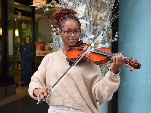 Busking violinist set to travel for dentistry school - The Royal ...